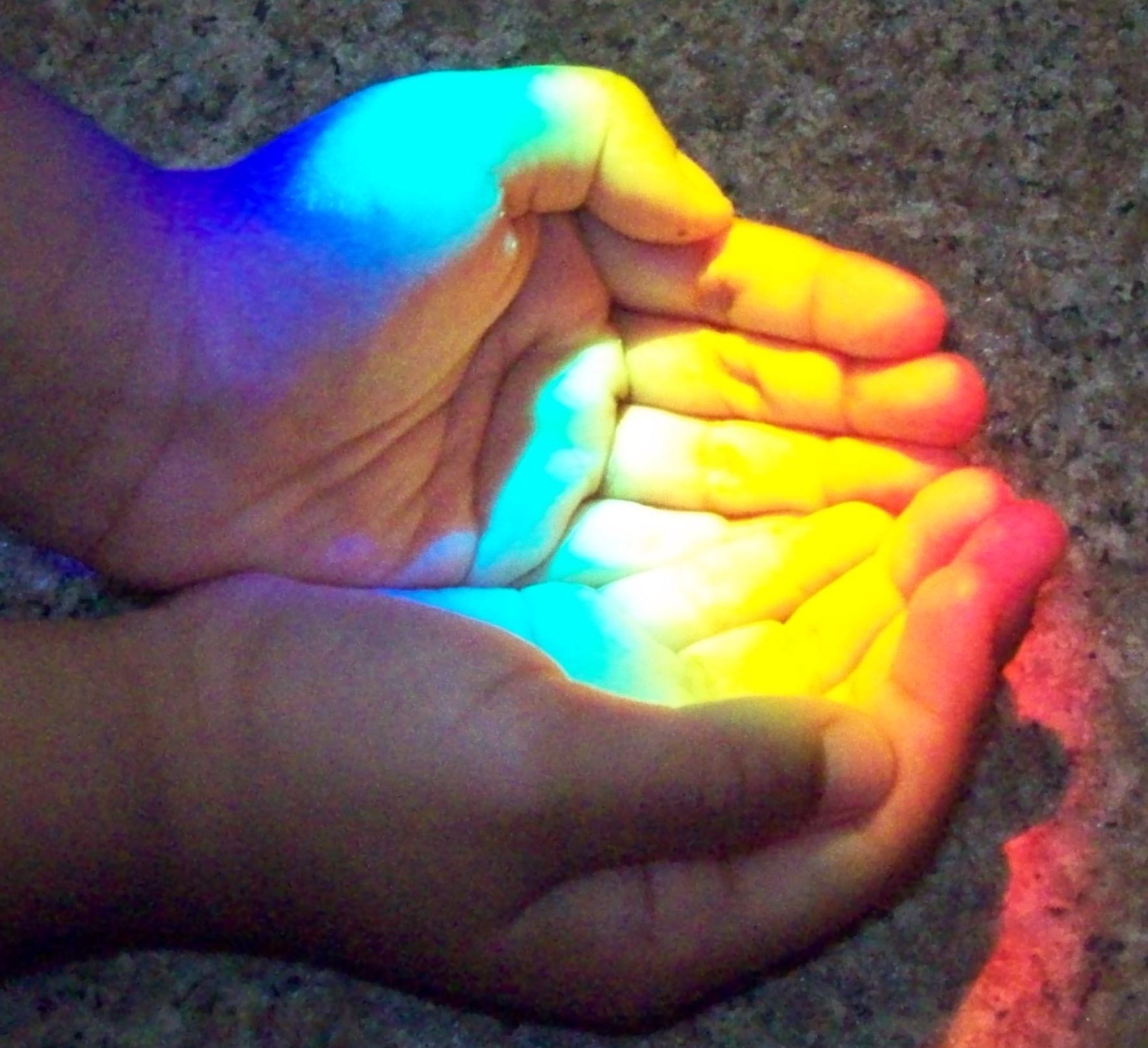 AC'sHandsLightedByRainbow